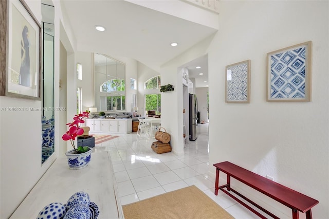 hallway featuring light tile patterned floors