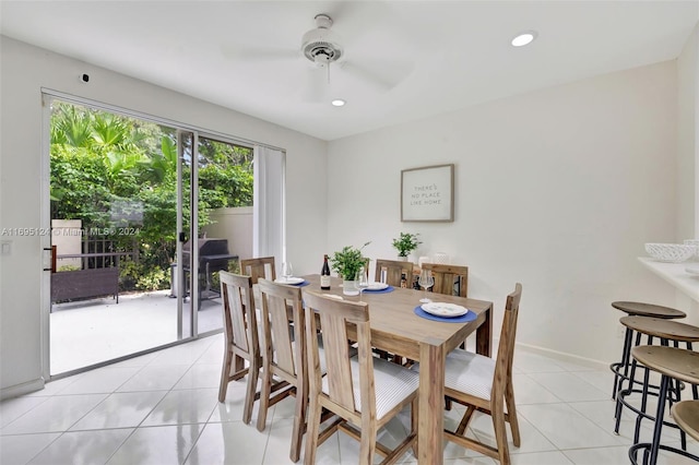 tiled dining area with ceiling fan