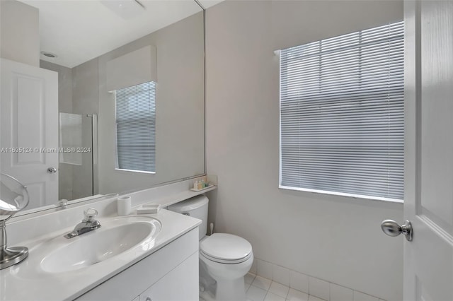 bathroom featuring toilet, vanity, and tile patterned floors