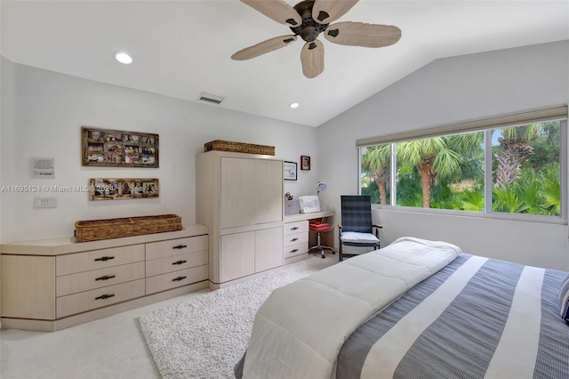 carpeted bedroom featuring ceiling fan and lofted ceiling