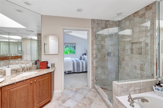 bathroom with vanity, independent shower and bath, and lofted ceiling