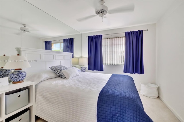 bedroom with ceiling fan and carpet