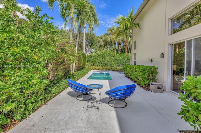 view of patio / terrace featuring a fenced in pool