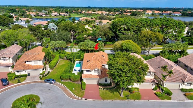 birds eye view of property with a water view