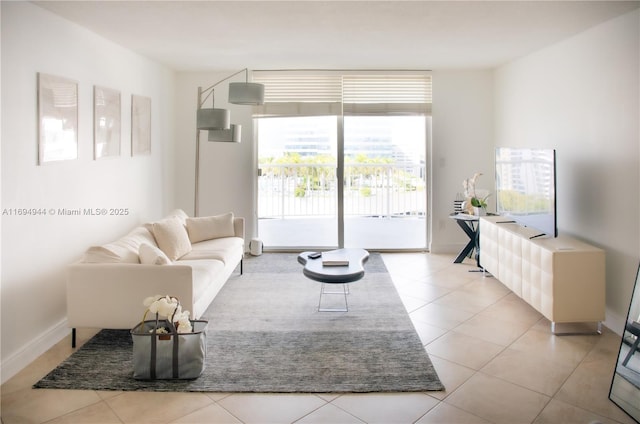 tiled living room featuring plenty of natural light