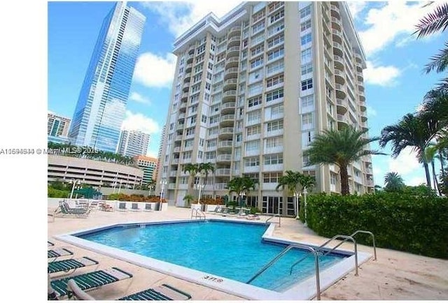 1420 Brickell Bay Dr Unit 1506D, Miami, FL 33131 - community pool featuring a patio area