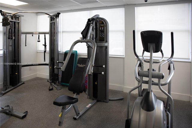 workout area featuring a drop ceiling