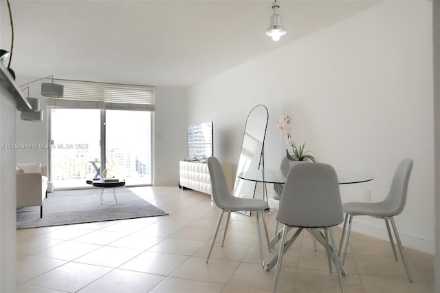 dining space featuring light tile patterned floors