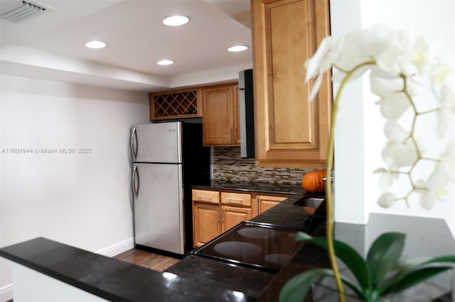 1420 Brickell Bay Dr Unit 1506D, Miami, FL 33131 - kitchen with freestanding refrigerator, backsplash, dark countertops, range, and recessed lighting
