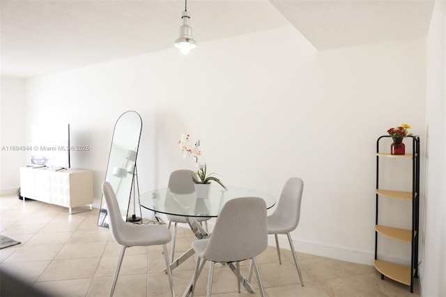 1420 Brickell Bay Dr Unit 1506D, Miami, FL 33131 - dining space with light tile patterned floors and baseboards