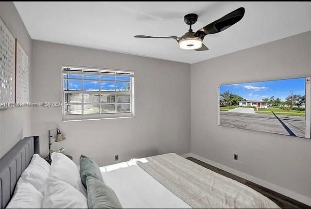 bedroom featuring ceiling fan and wood-type flooring