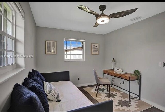 bedroom featuring light hardwood / wood-style flooring and ceiling fan