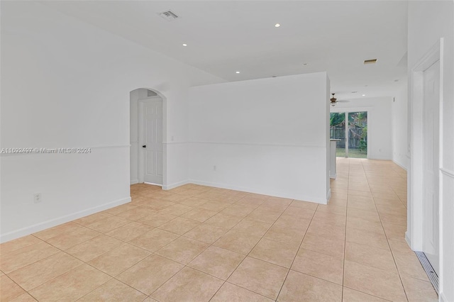 unfurnished room featuring ceiling fan and light tile patterned floors