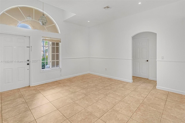 foyer entrance with light tile patterned flooring