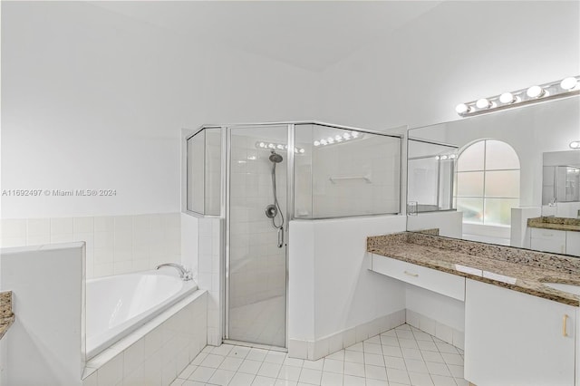 bathroom featuring tile patterned floors, vanity, and separate shower and tub