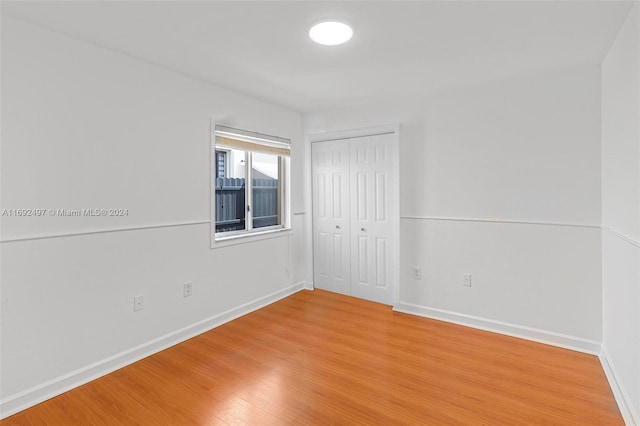 spare room with hardwood / wood-style floors