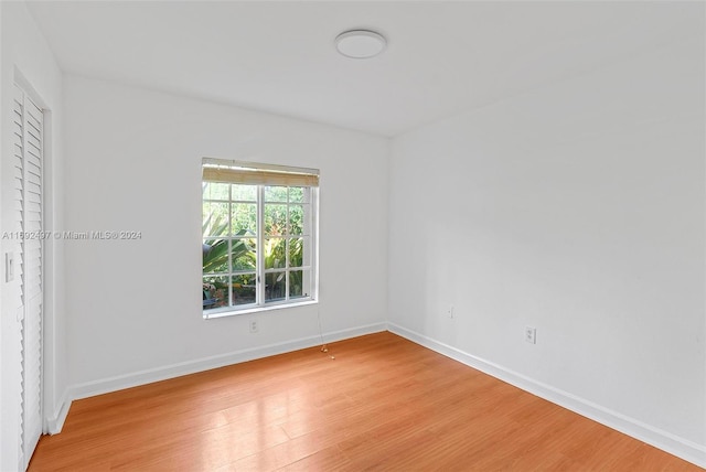 unfurnished room featuring light wood-type flooring