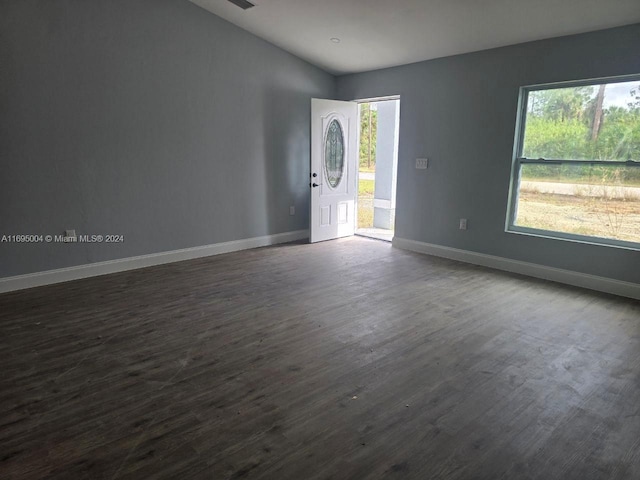 unfurnished room with dark hardwood / wood-style floors