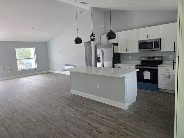 kitchen with white cabinets, a kitchen island, hanging light fixtures, and appliances with stainless steel finishes