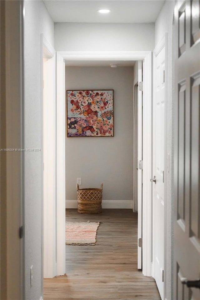 corridor featuring light hardwood / wood-style floors