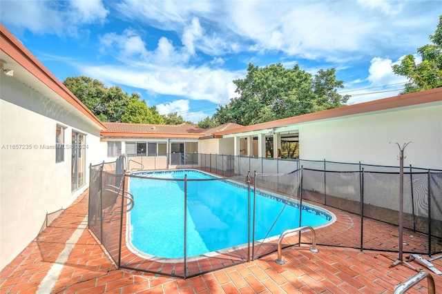 view of pool featuring a patio area