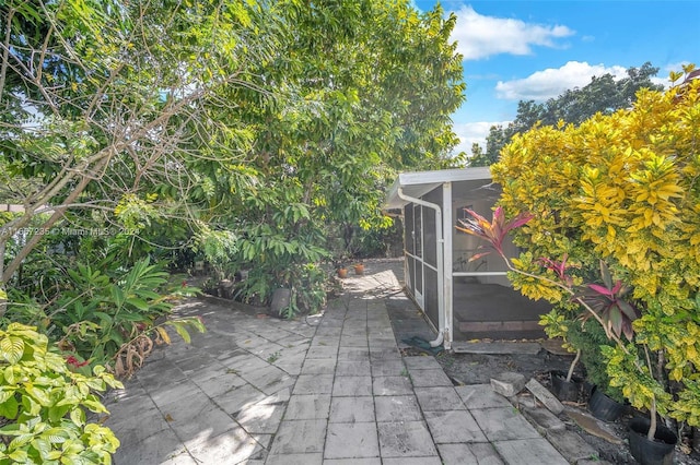 view of patio / terrace with a sunroom