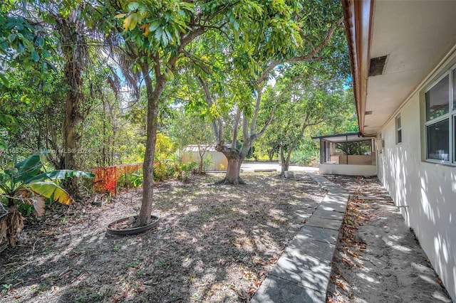 view of yard with a sunroom