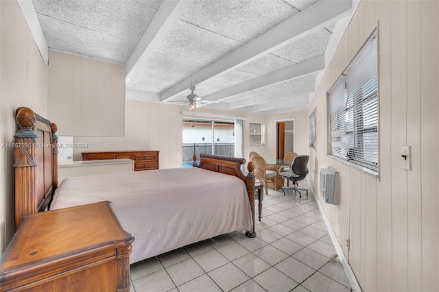 bedroom featuring ceiling fan, light tile patterned floors, and multiple windows