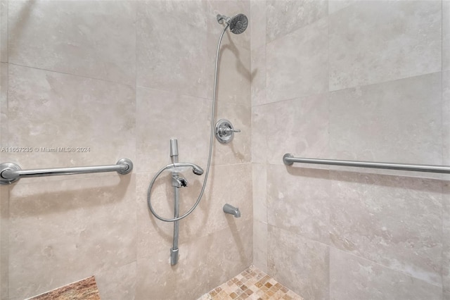 bathroom with a tile shower