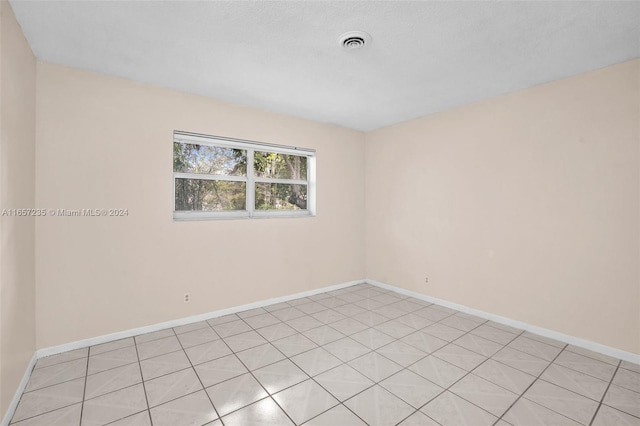 view of tiled spare room