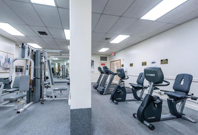 workout area featuring a drop ceiling