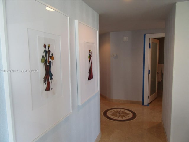 hallway with light tile patterned floors