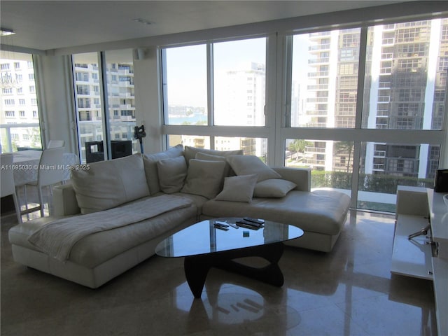 living room featuring a wall of windows