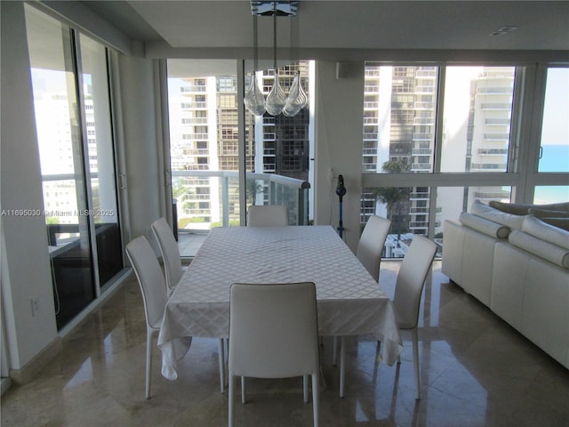 dining space with an inviting chandelier