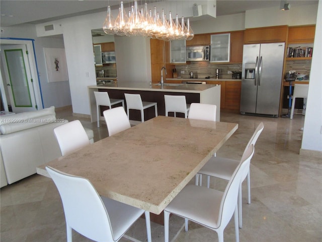 dining room featuring sink