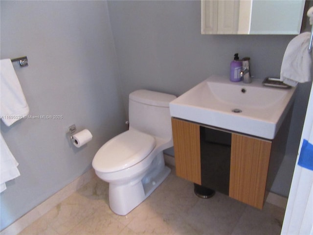 bathroom featuring toilet and sink