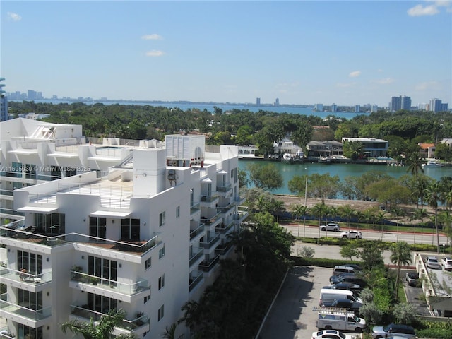 birds eye view of property with a water view