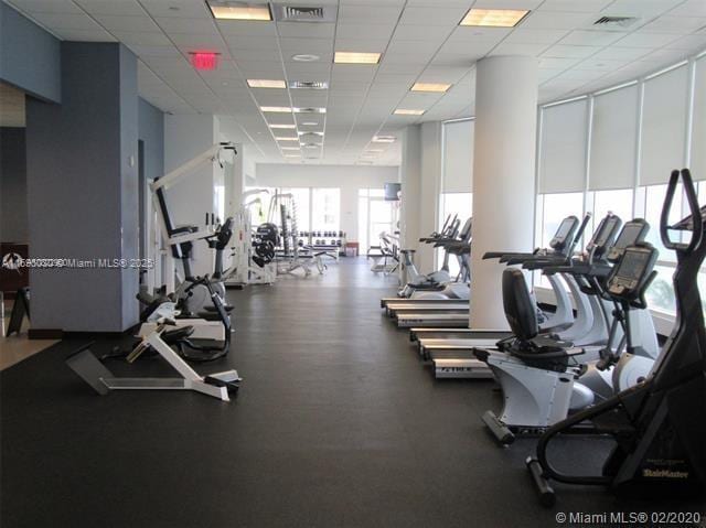 gym featuring a drop ceiling