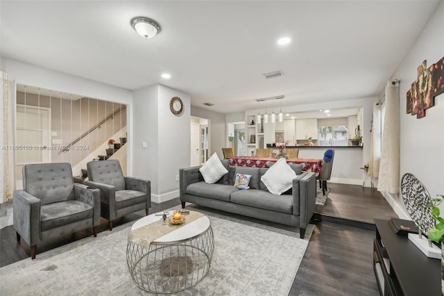 living room featuring dark wood-type flooring