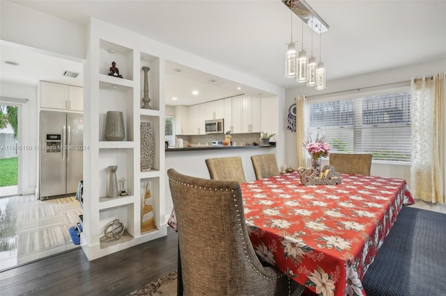 dining room featuring dark hardwood / wood-style flooring