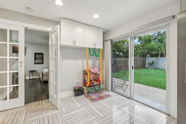 interior space featuring french doors and light wood-type flooring