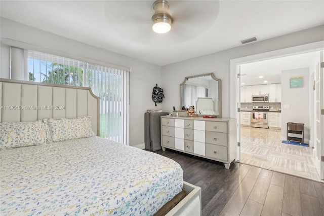 bedroom with ceiling fan and dark wood-type flooring