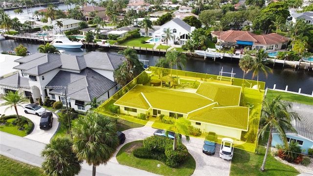 birds eye view of property featuring a water view