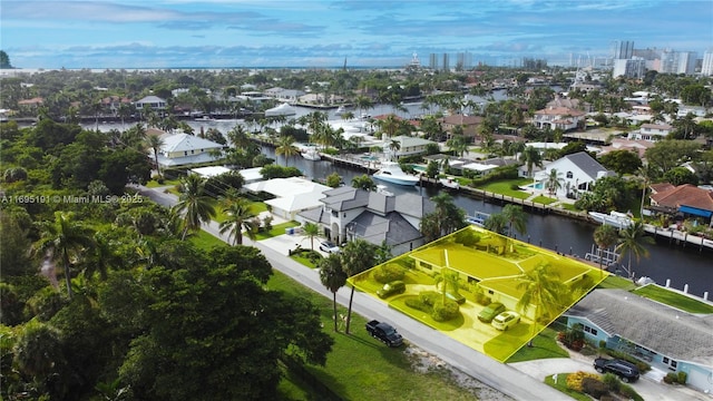 birds eye view of property with a water view