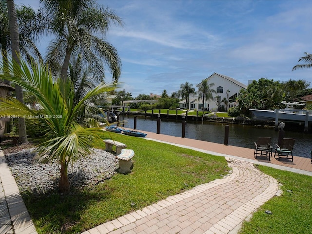 exterior space with a yard and a water view