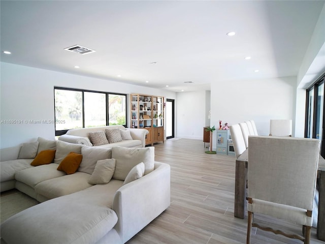 living room with light hardwood / wood-style flooring