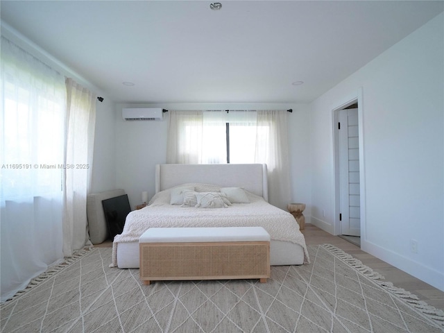 bedroom featuring a wall mounted air conditioner