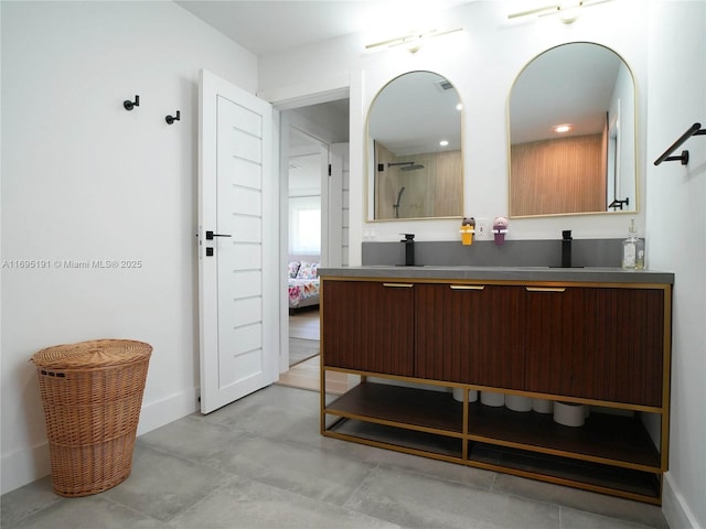 bathroom with vanity and concrete flooring