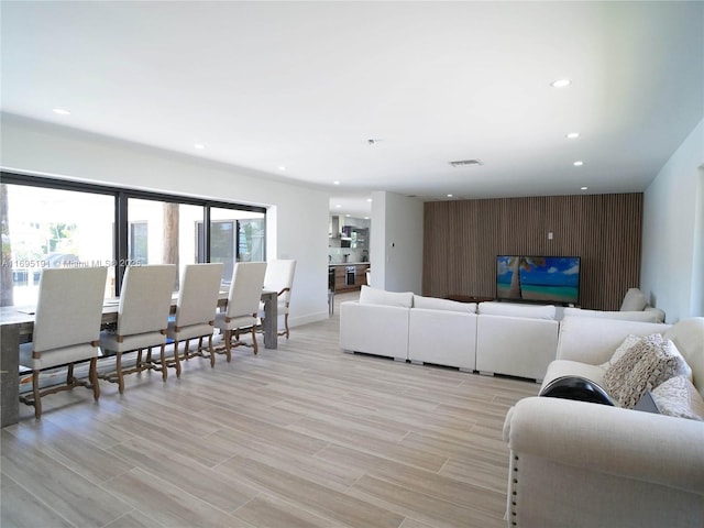 living room with light hardwood / wood-style flooring