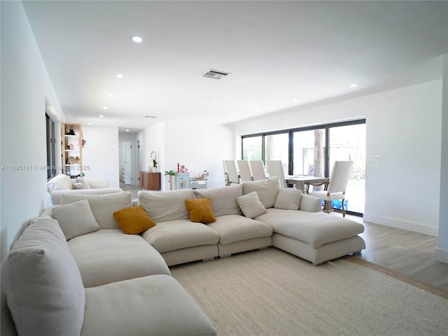 living room with light hardwood / wood-style floors